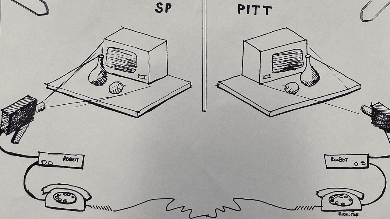 Hand-drawn sketch showing two nearly identical setups mirrored and connected through cable.