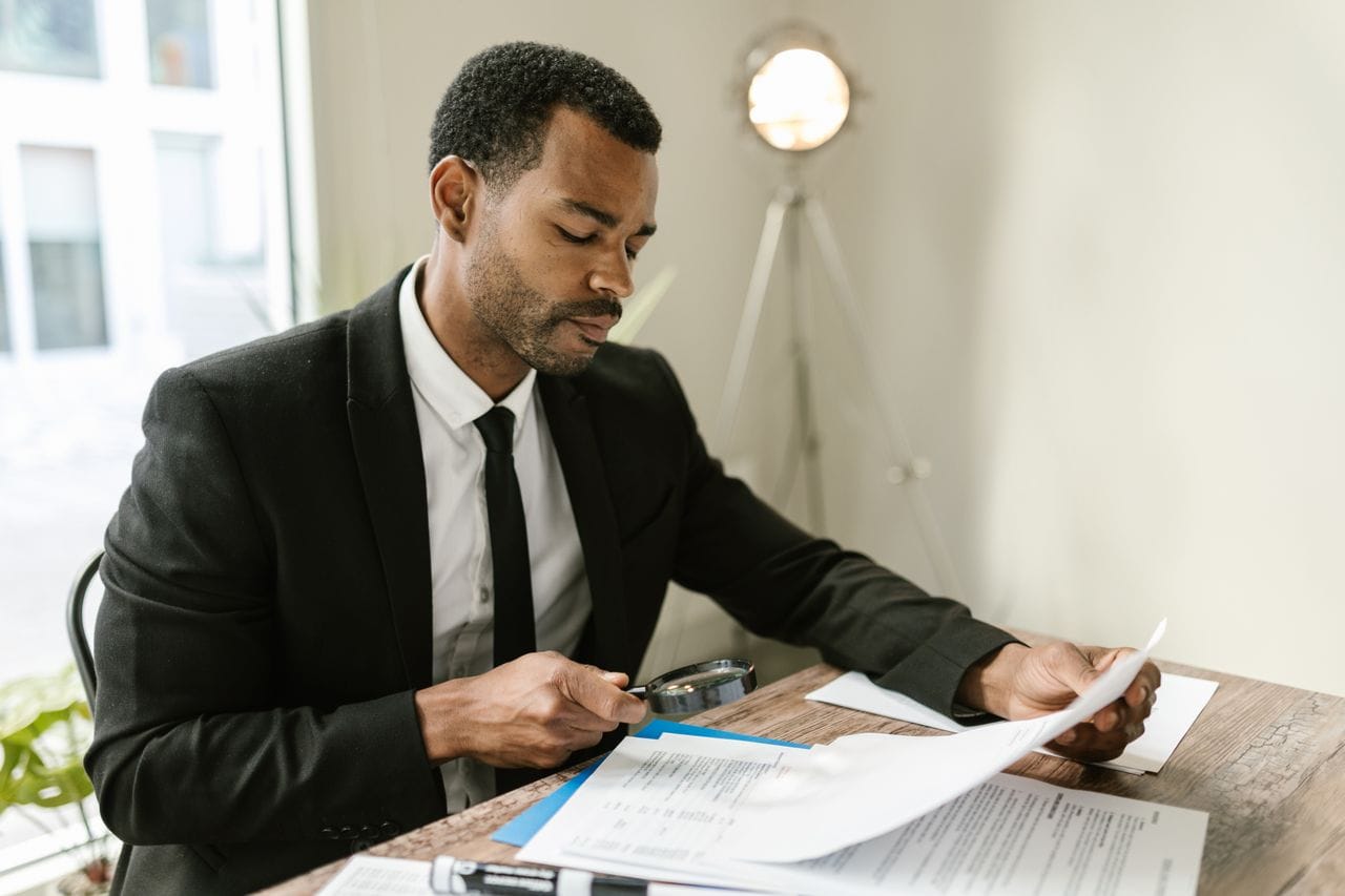 Tender CVs and case studies being checked against evaluation criteria