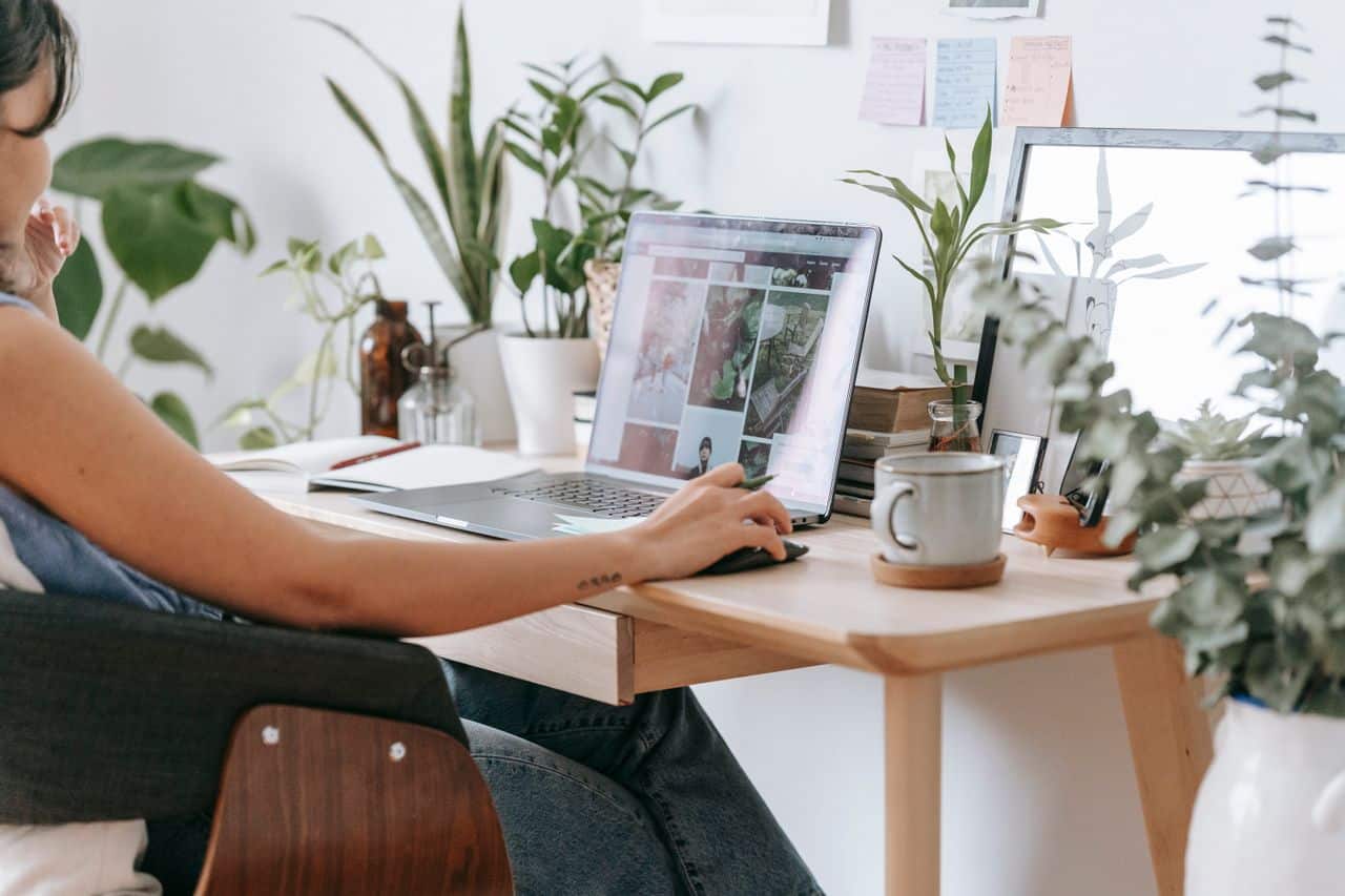 Woman conducting a virtual session for spiritual or holistic practice.