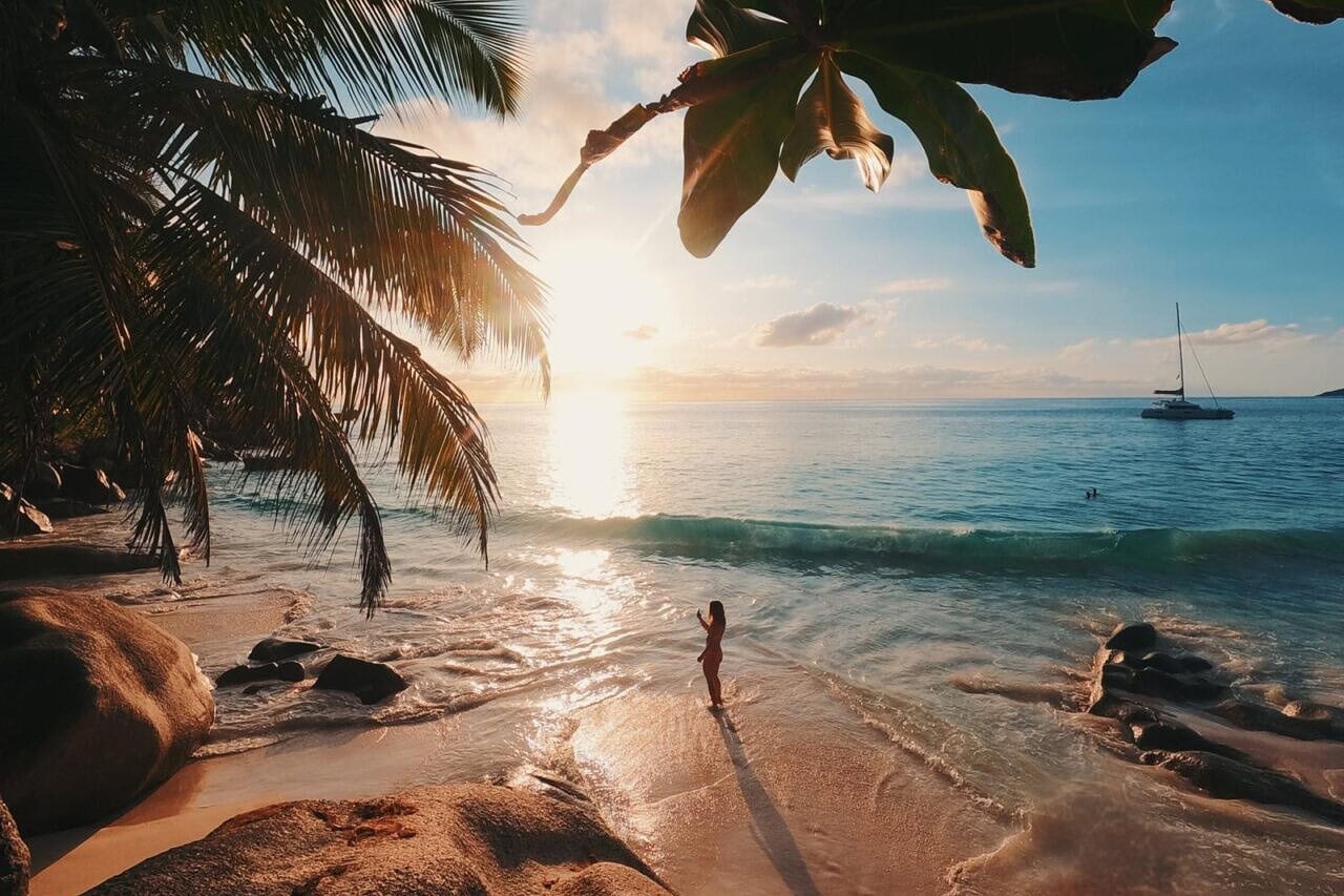 sunset-anse georgette-seychelles anse georgette beach at sunset with palms in the background