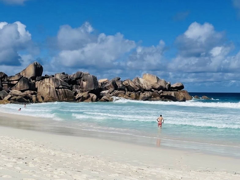 Grand Anse beach view in La Digue, Seychelles, with giant granite boulders in the background