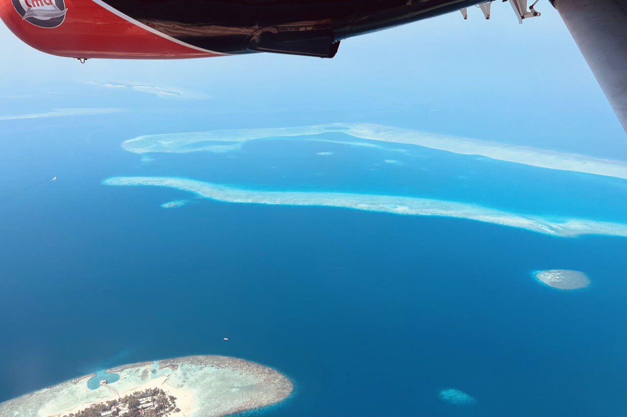 Bird eye view of maldives islands from seaplane