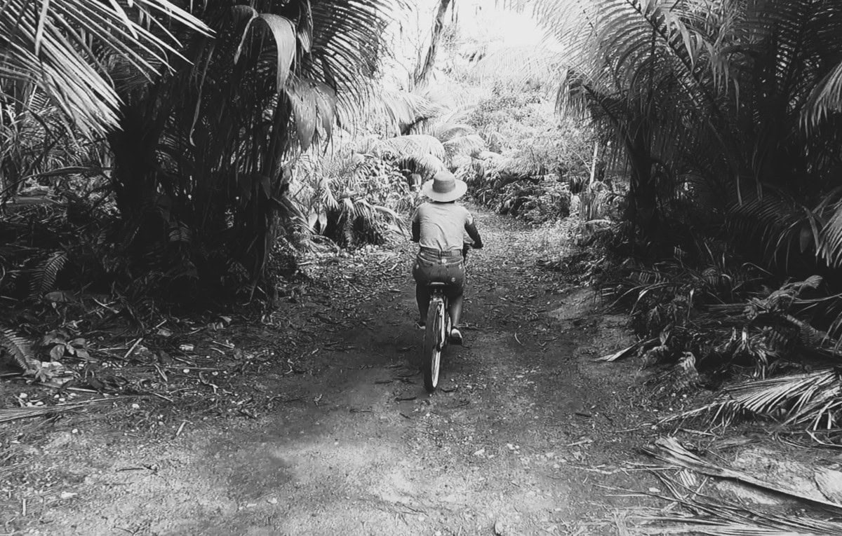 bike_jungle_denis_seychelles_black_and_white Woman on a bike in the jungle