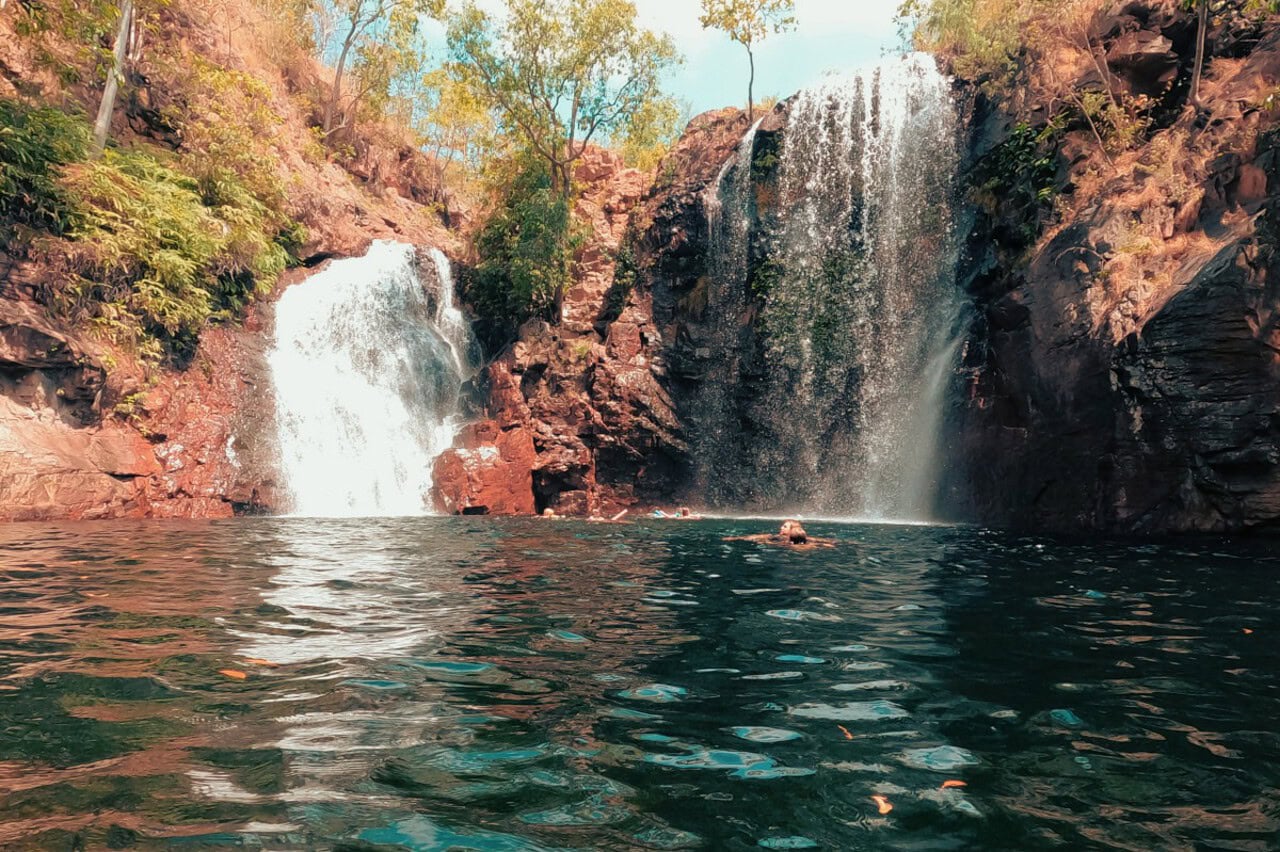 Twin waterfalls in Litchfield plunging into a natural freshwater pool, one of the top things to see in a Litchfield itinerary