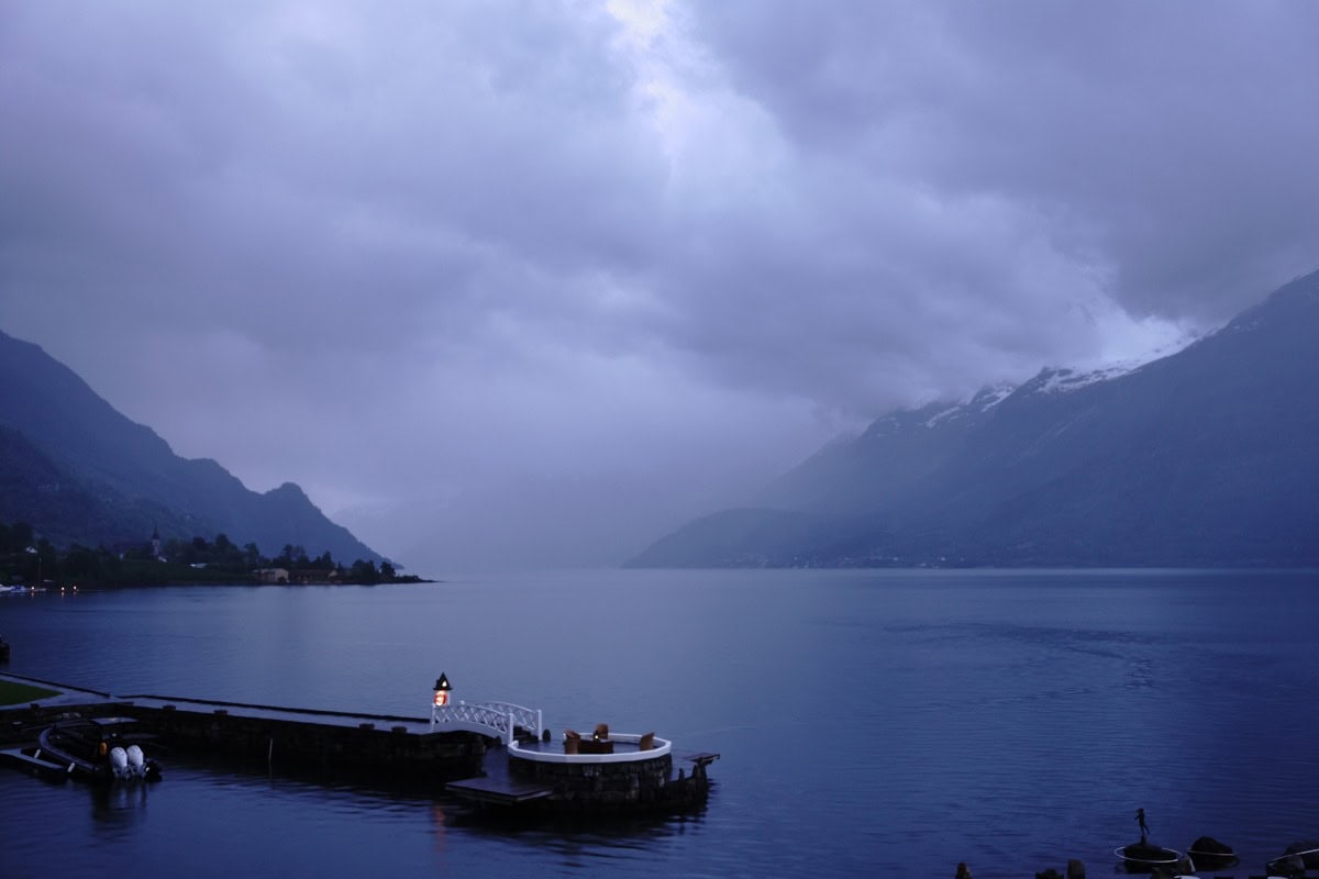 Dramatic view of hardangerfjord with cloudy sky, one the most famous fjords outside bergen