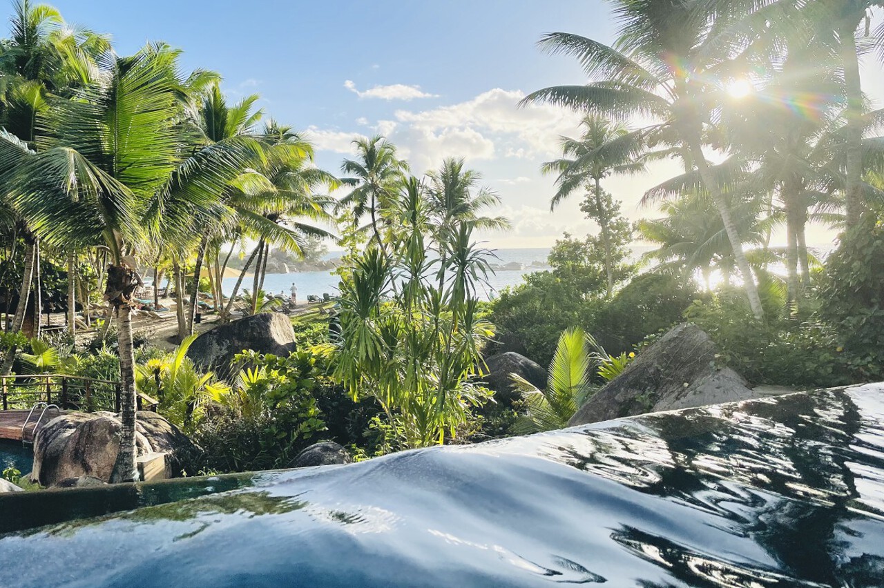 pool_costance_lemuria_praslin Swimming pool and tropical palms at the Constance Lemuria, Praslin