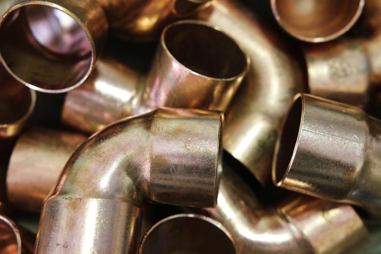 Image of many copper pipe joints.
