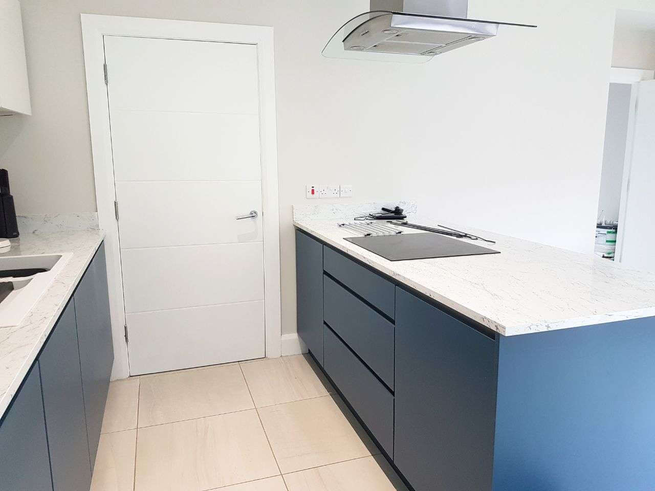 Modern kitchen with blue cabinets and countertop