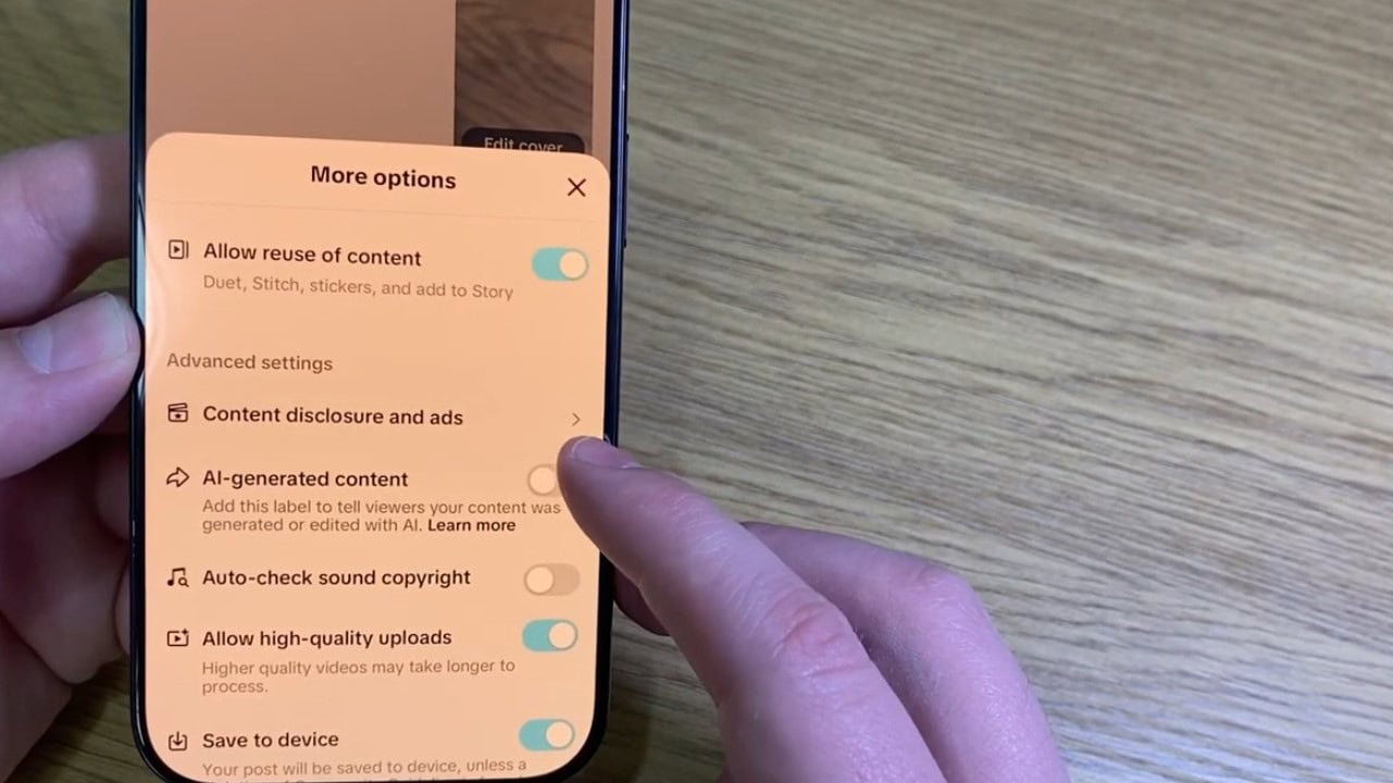 A close-up of the TikTok mobile app posting screen with the "AI-generated content" toggle switched