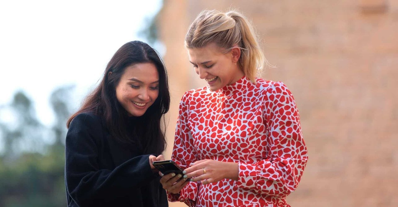 Students reading cellphone 