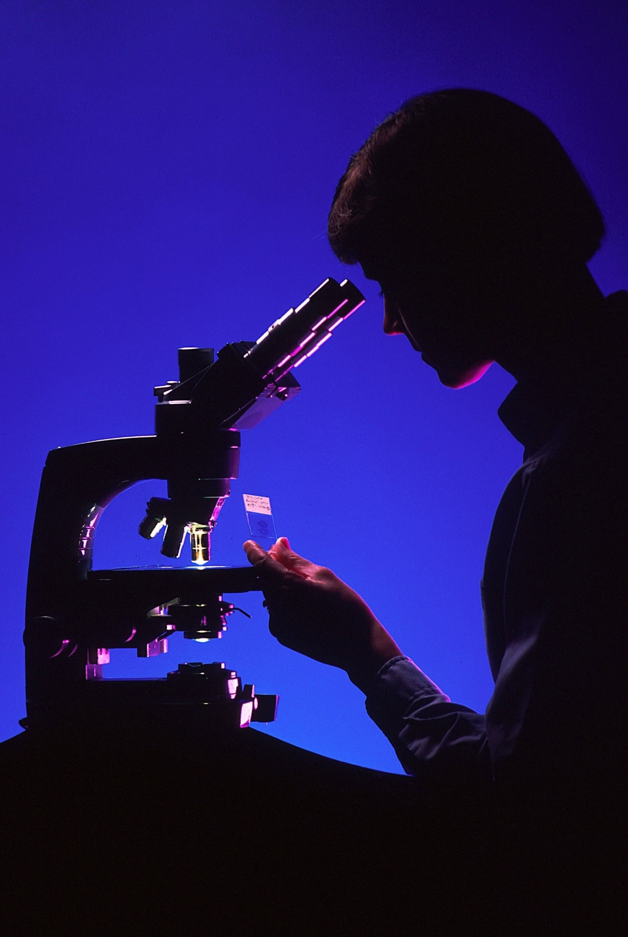 scientist-with-microscope-996187