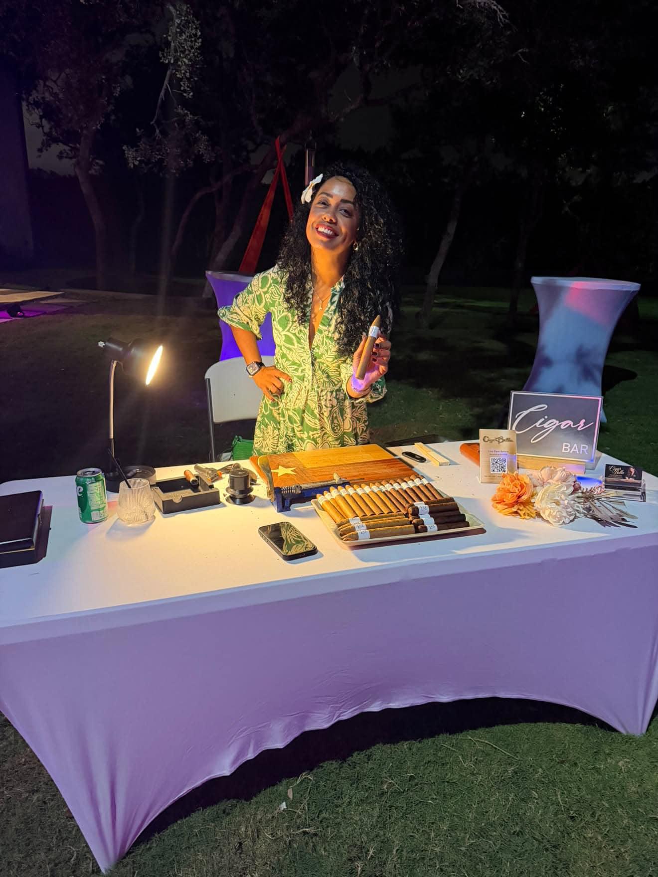 Cigar Bella female cigar roller at an elegant nighttime private event near Spicewood Texas