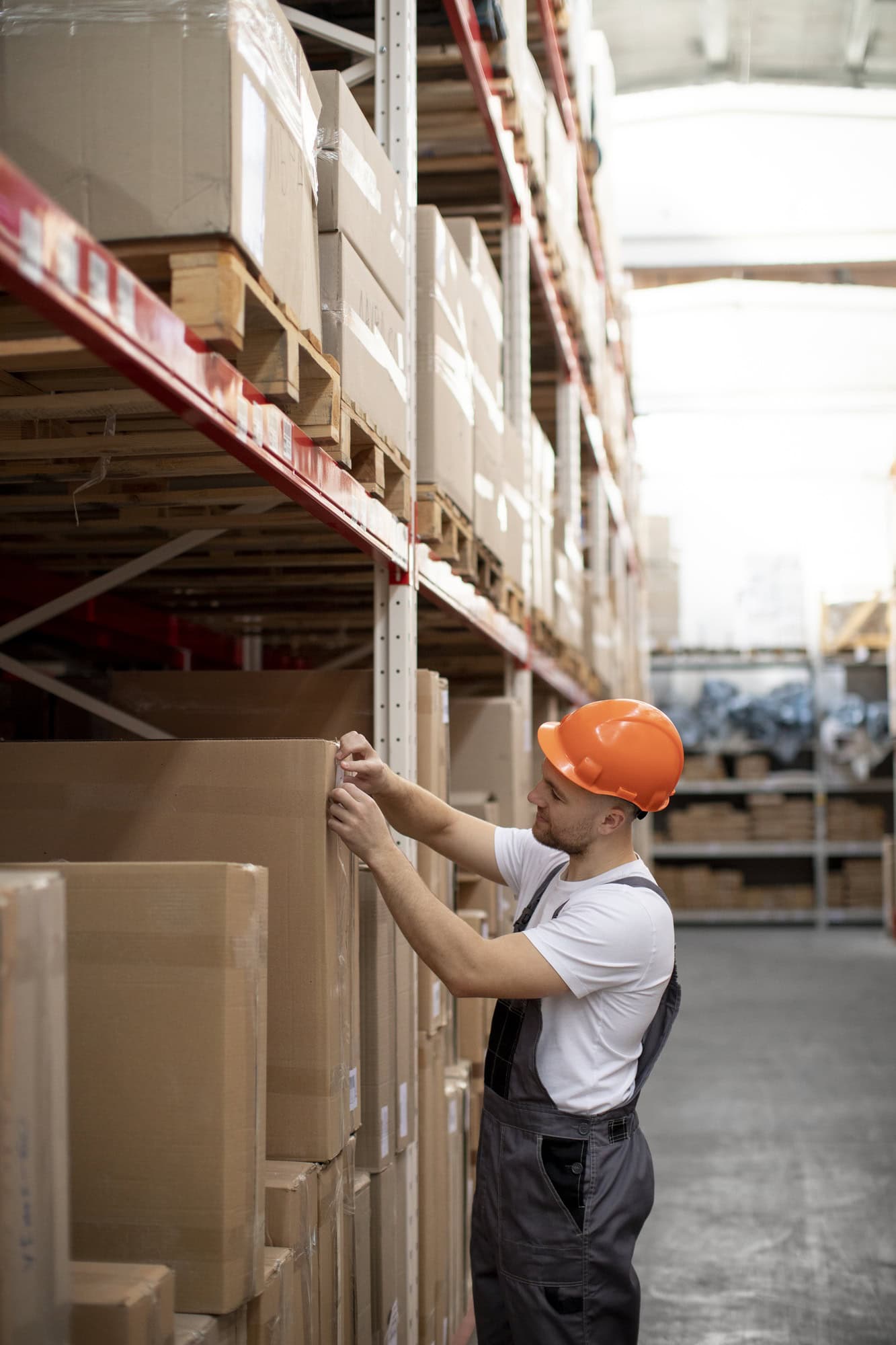medium-shot-man-working-warehouse