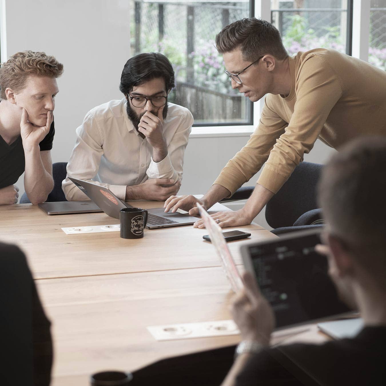 B2B marketing team collaborating on integrated wraparound marketing strategy