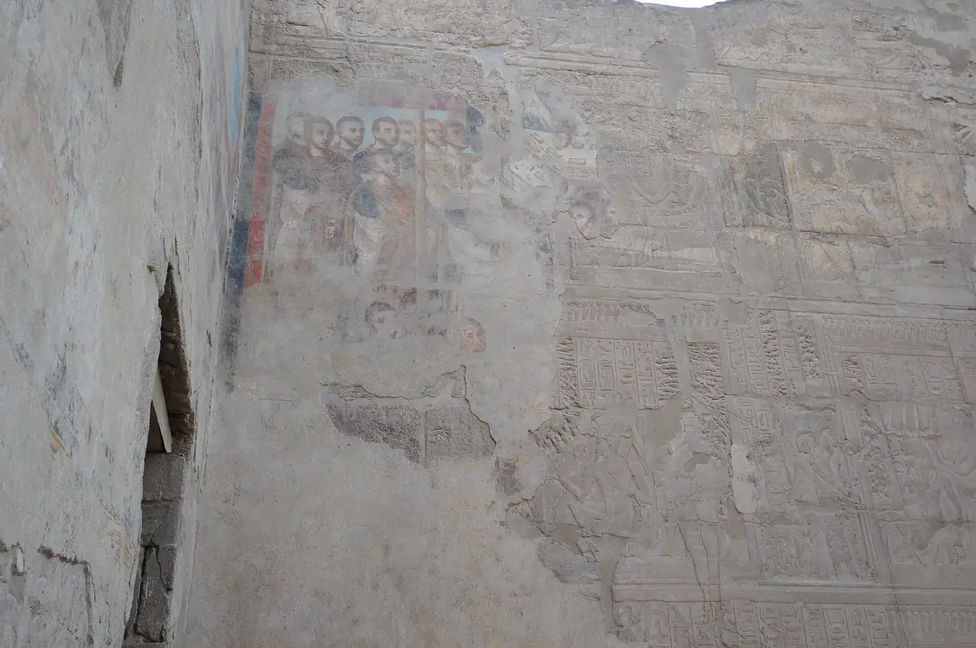 Faded Roman imperial frescoes preserved on an ancient wall