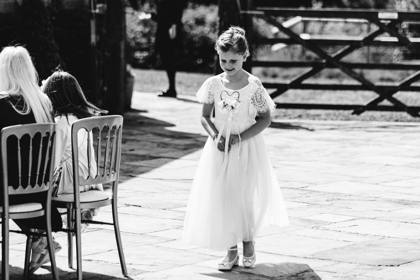 an outdoor ceremony with the bride walking down the aisle to get married at heaton house farm