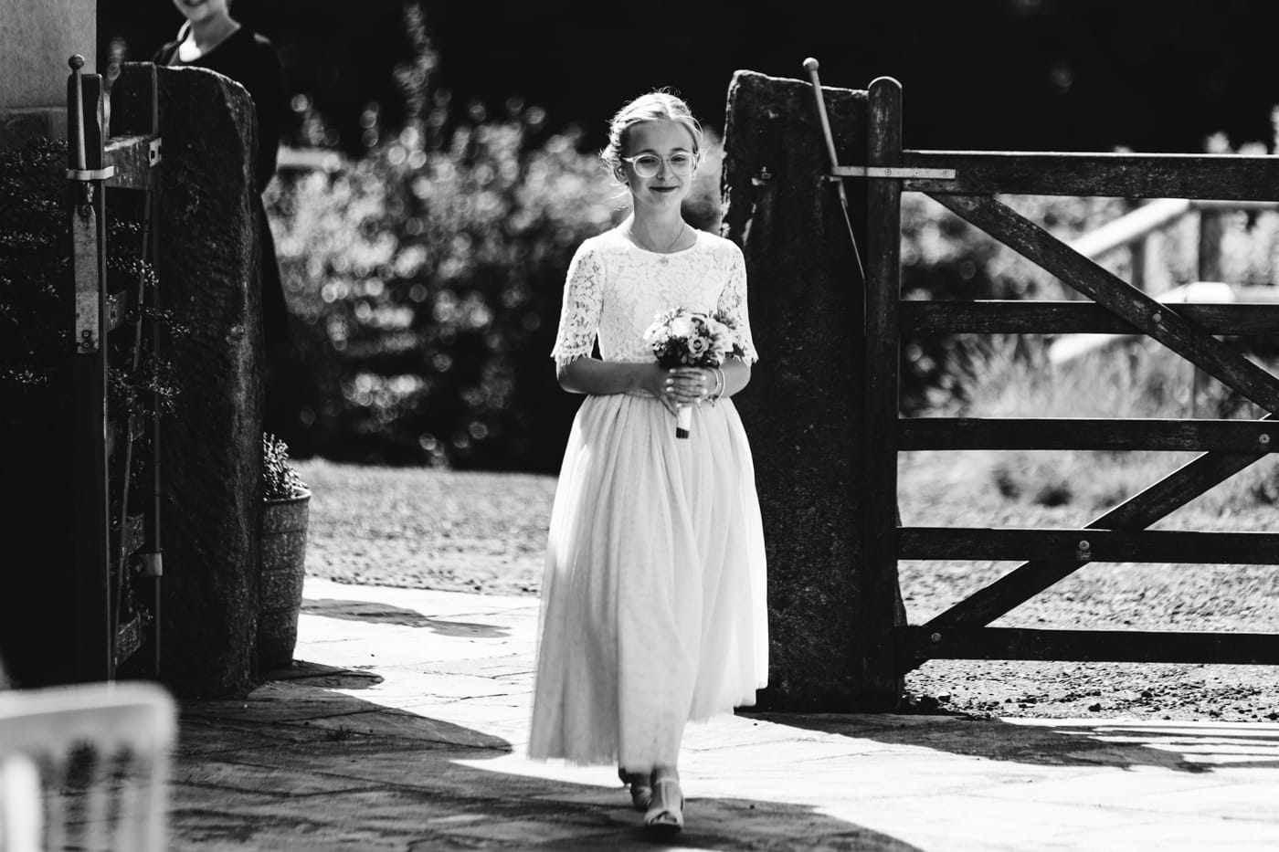 an outdoor ceremony with the bride walking down the aisle to get married at heaton house farm