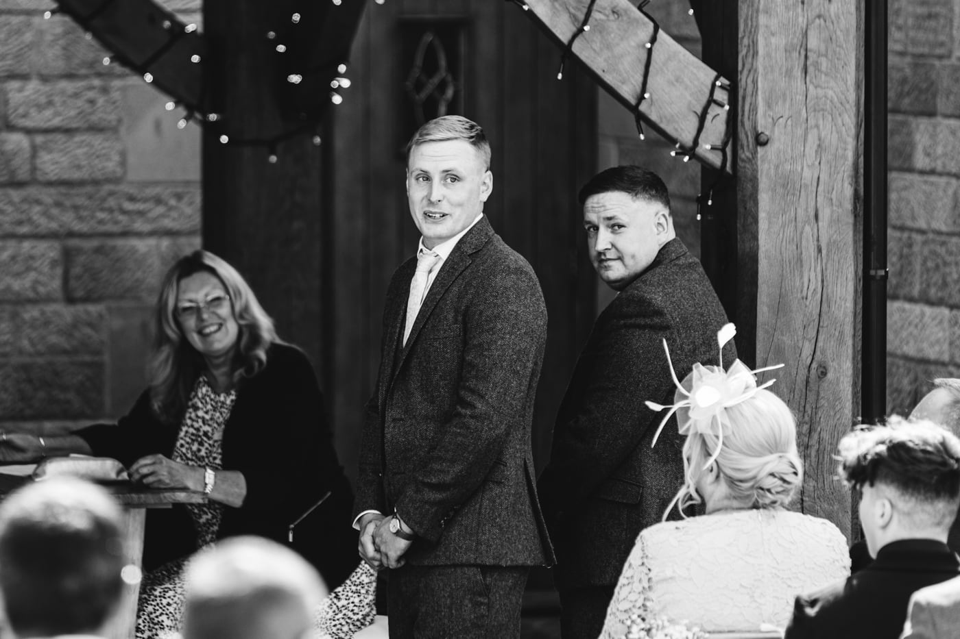 an outdoor ceremony with the bride walking down the aisle to get married at heaton house farm