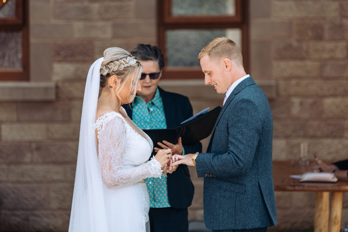 an outdoor ceremony with the bride walking down the aisle to get married at heaton house farm
