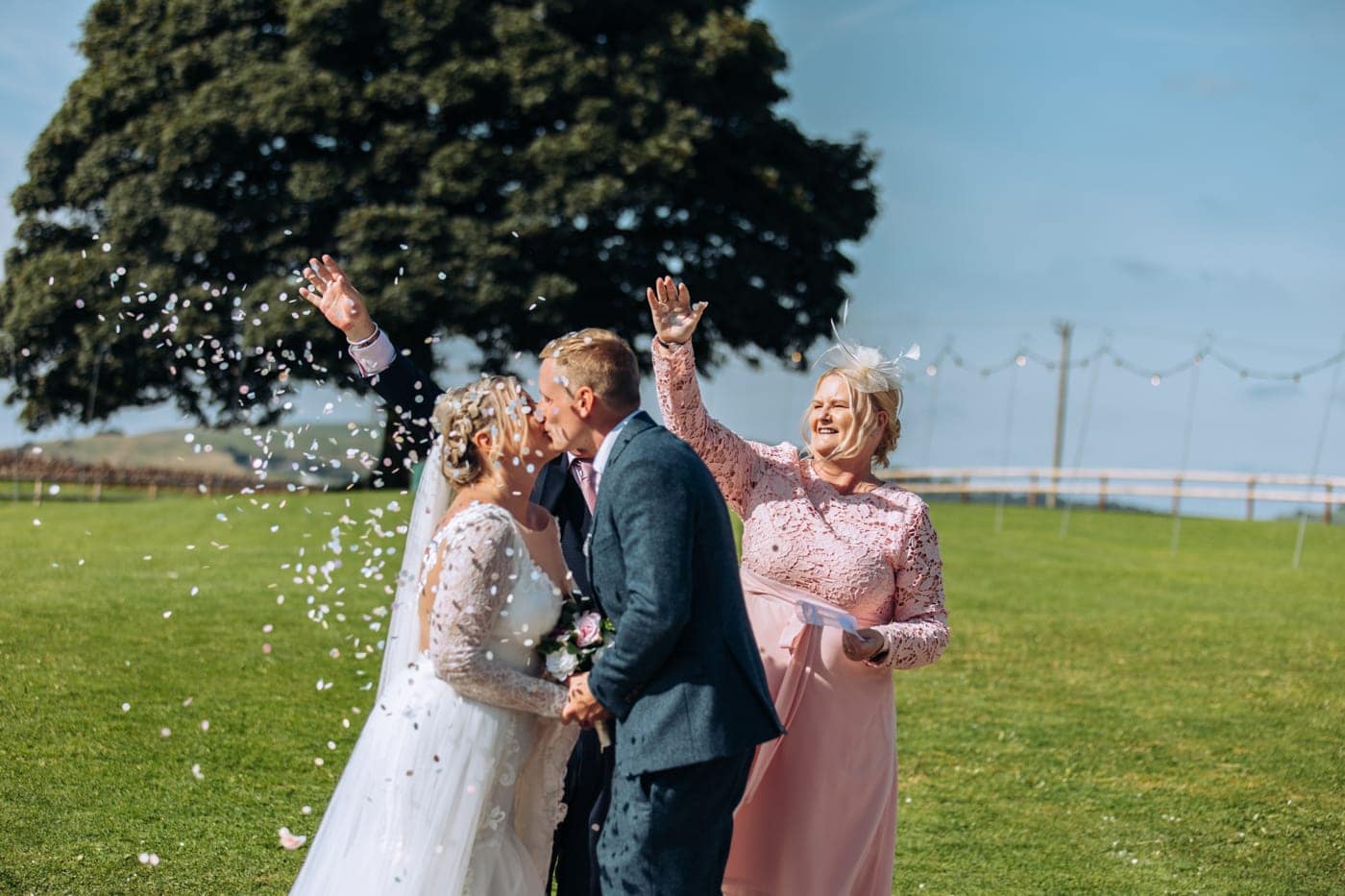 candid wedding photography taken during the speeches and outside in the grounds of heaton house farm in cheshire