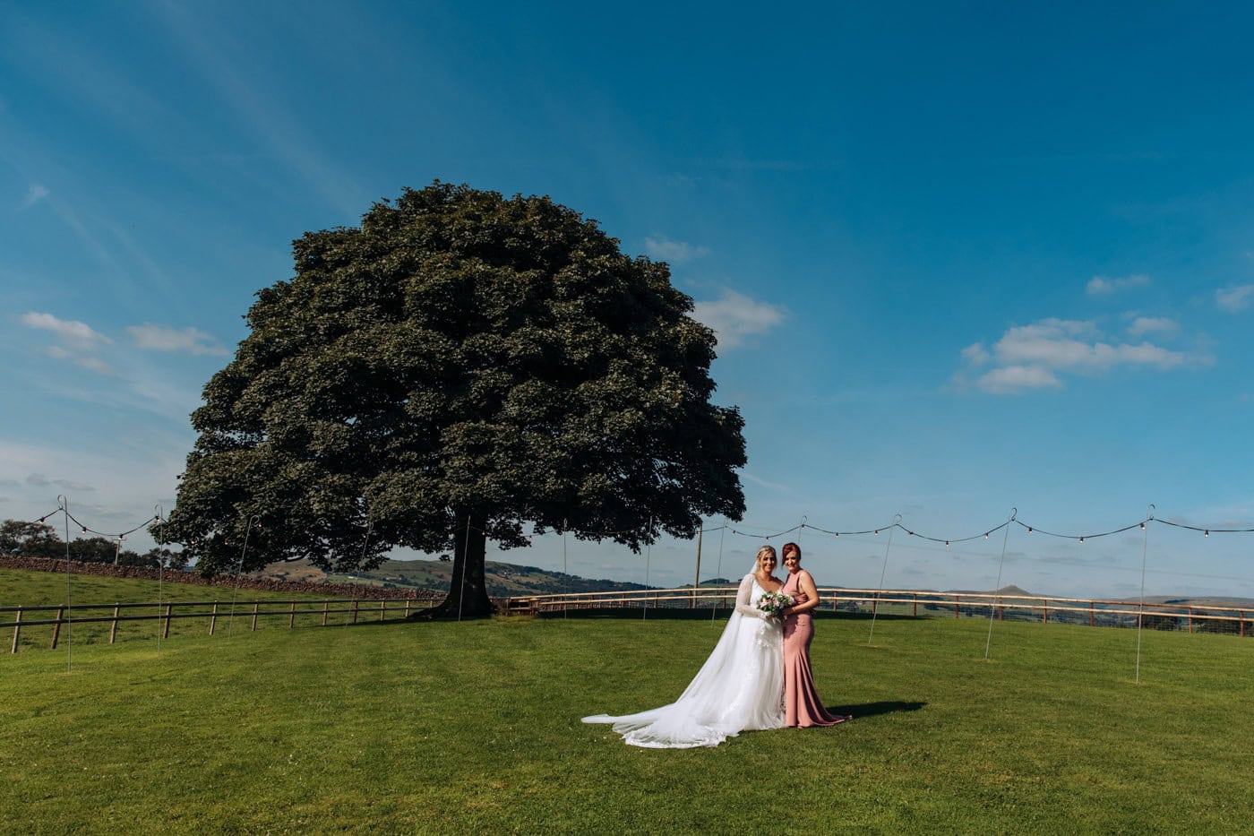 candid wedding photography taken during the speeches and outside in the grounds of heaton house farm in cheshire