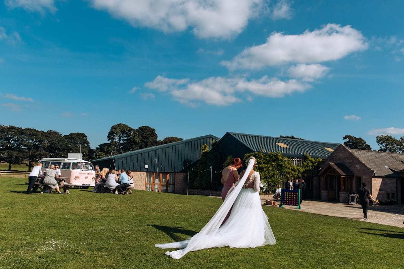 candid wedding photography taken during the speeches and outside in the grounds of heaton house farm in cheshire