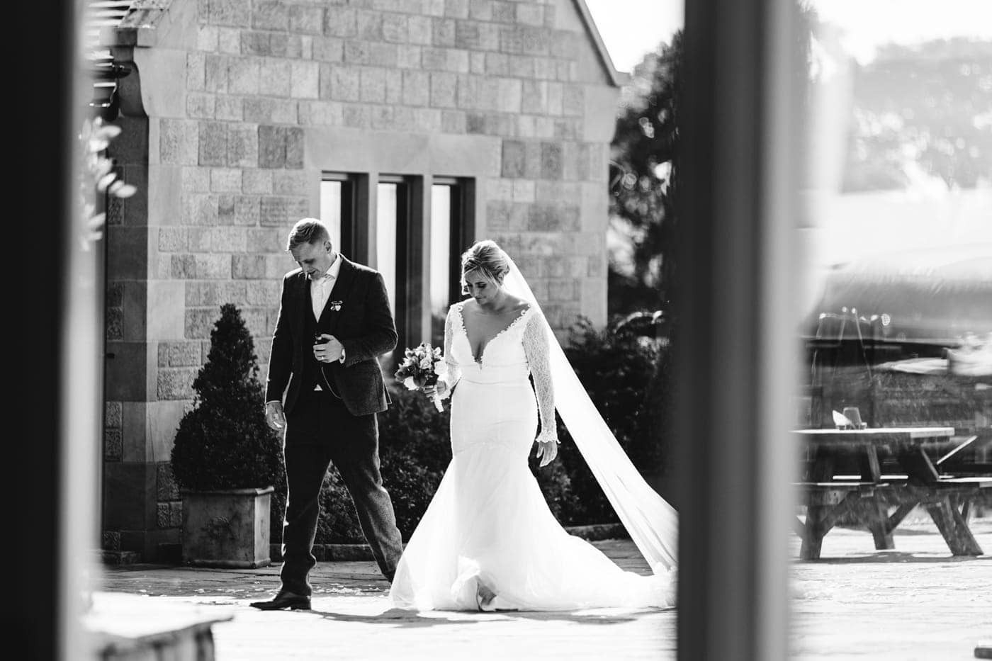 candid wedding photography taken during the speeches and outside in the grounds of heaton house farm in cheshire