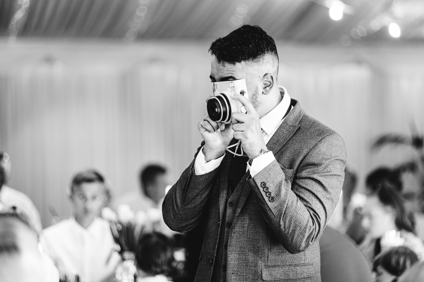 candid wedding photography taken during the speeches and outside in the grounds of heaton house farm in cheshire