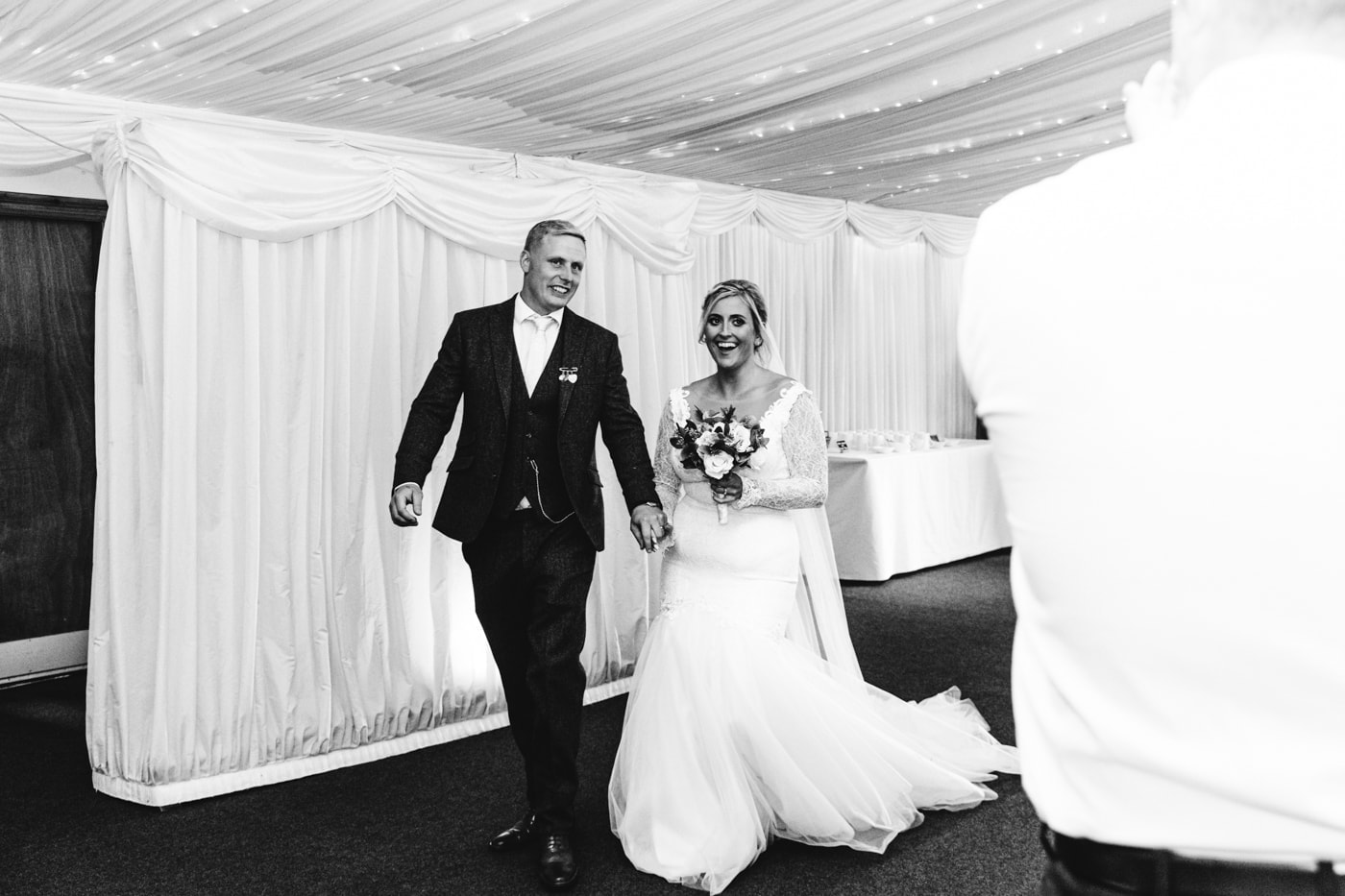candid wedding photography taken during the speeches and outside in the grounds of heaton house farm in cheshire