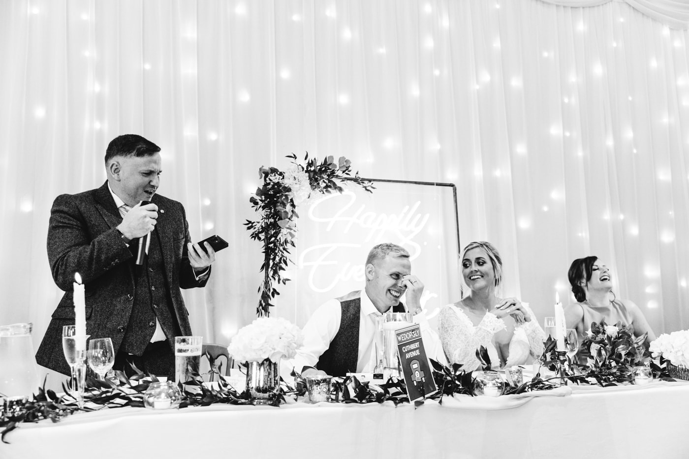 candid wedding photography taken during the speeches and outside in the grounds of heaton house farm in cheshire