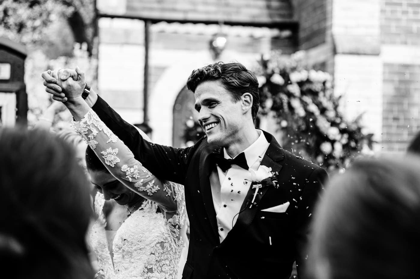 confetti outside the chapel at eshott hall wedding photography