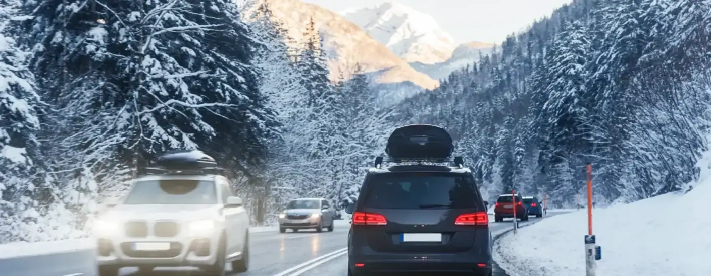 Vehicles driving on a snowy mountain road in Asfinag’s video surveillance system project in Austria
