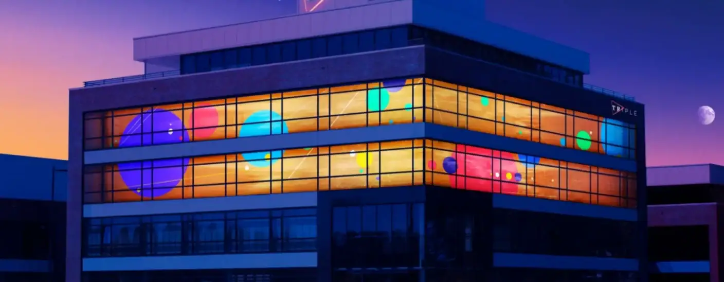 TRIPLE digital agency, users of ATLAS access control, office building illuminated at night in Alkmaar, Netherlands