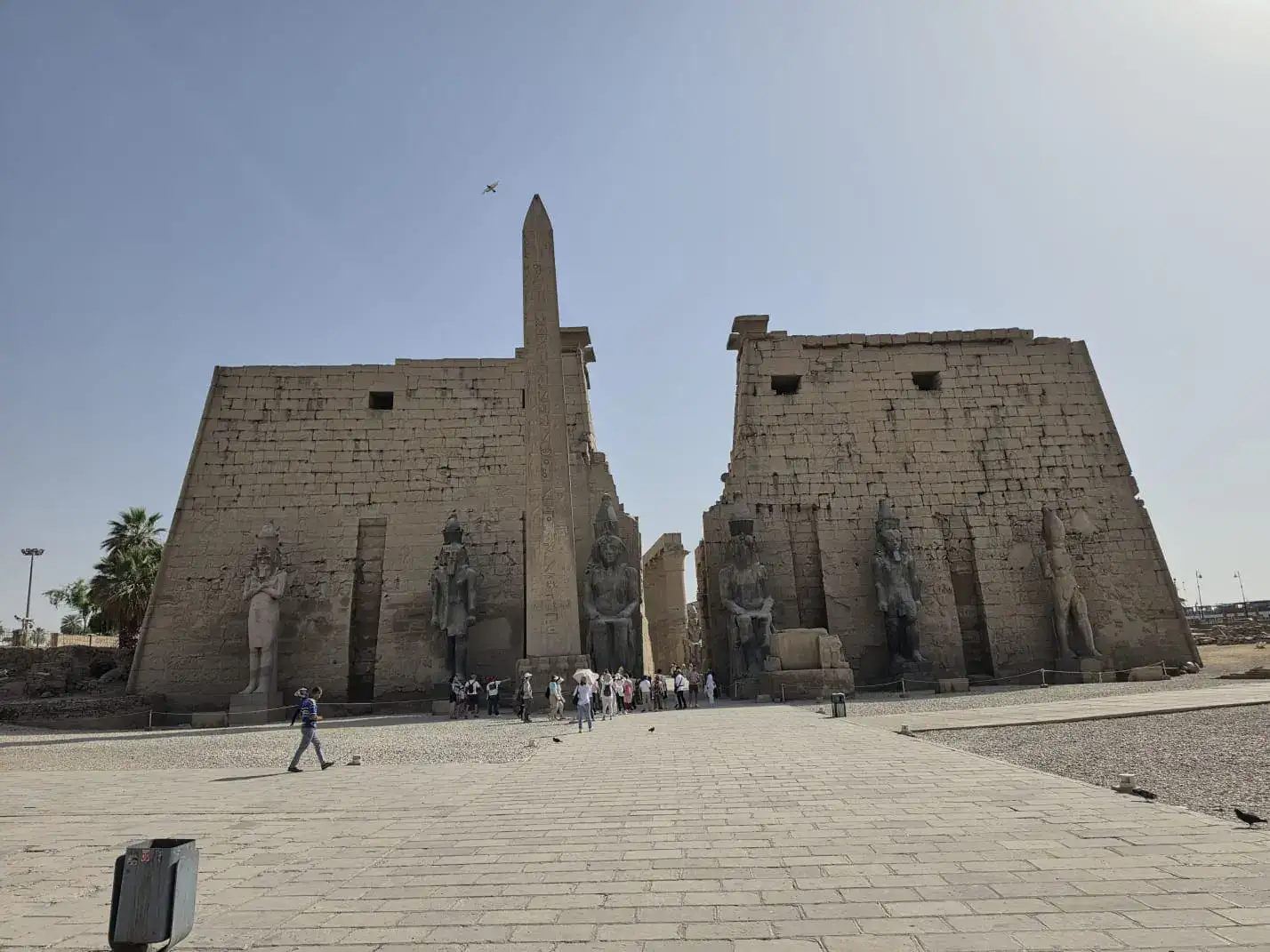 Luxor Temple first pylon, surviving obelisk and statues of Ramses II