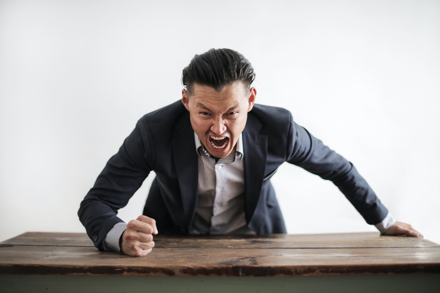 Man in suit screaming