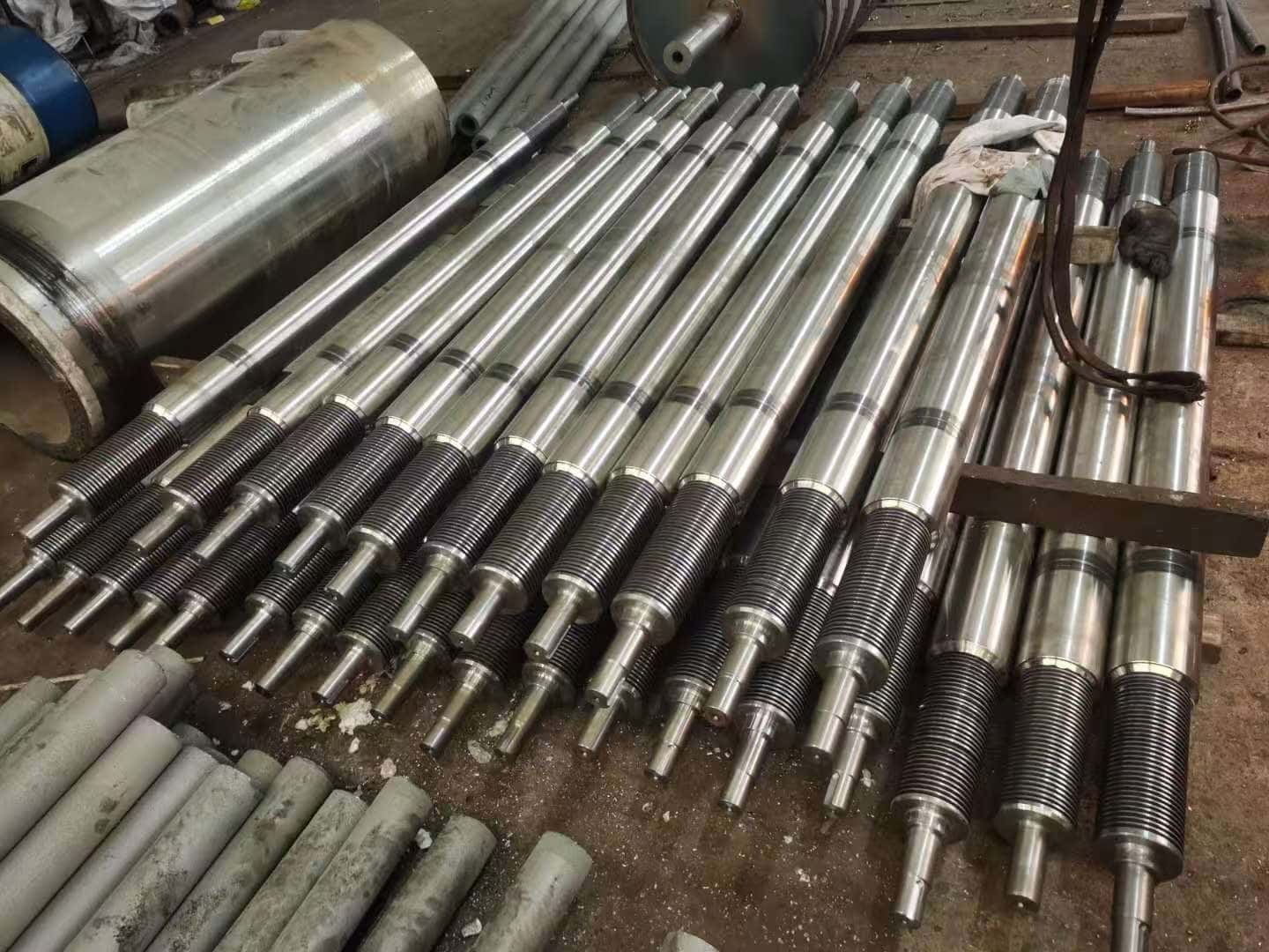 Furnace roller shafts with stepped journals arranged together in the factory