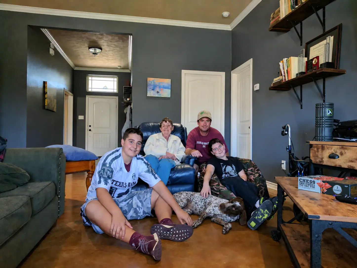 Scott Lingren with his family and their dog Rambo at home.