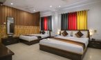 family hotel room in Indore with multiple beds