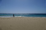 Woman walking on the beach of Morro Jable on Fuerteventura