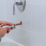 Plumber doing tub and shower repair service. Plumber orem. Plumbing near me. Emergency plumbing services.