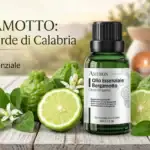 Flacone di olio essenziale di bergamotto con brucia essenze, candela e bergamotti freschi su tavolo in legno
