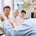 Businessman speaking on presentation