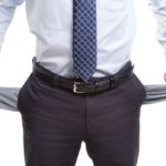 Broke and poor business man with empty pockets