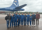 Black Swift Technologies and NOAA Hurricane Hunters standing in front of the NOAA P-3 Orion Hurricane Hunter Aircraft