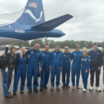 Black Swift Technologies and NOAA Hurricane Hunters standing in front of the NOAA P-3 Orion Hurricane Hunter Aircraft
