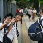 School kids in Tokyo, Japan greeting first-timers.