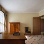Capturing the essence of hotel luxury: a detailed shot of a corridor or lounge area. Kirill Toll's professional photography services focus on ambiance and high-end finishes, providing assets that justify a premium price point.