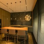 The original kitchen RAW file before editing, with a heavy yellow cast from the built-in lights and unbalanced shadows.