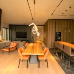 The original panoramic RAW file of the studio with mixed lighting, a strong yellow cast, and uncalibrated zone exposure.