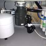 Donnie’s Plumbing technician replacing garbage disposal in Murrieta kitchen